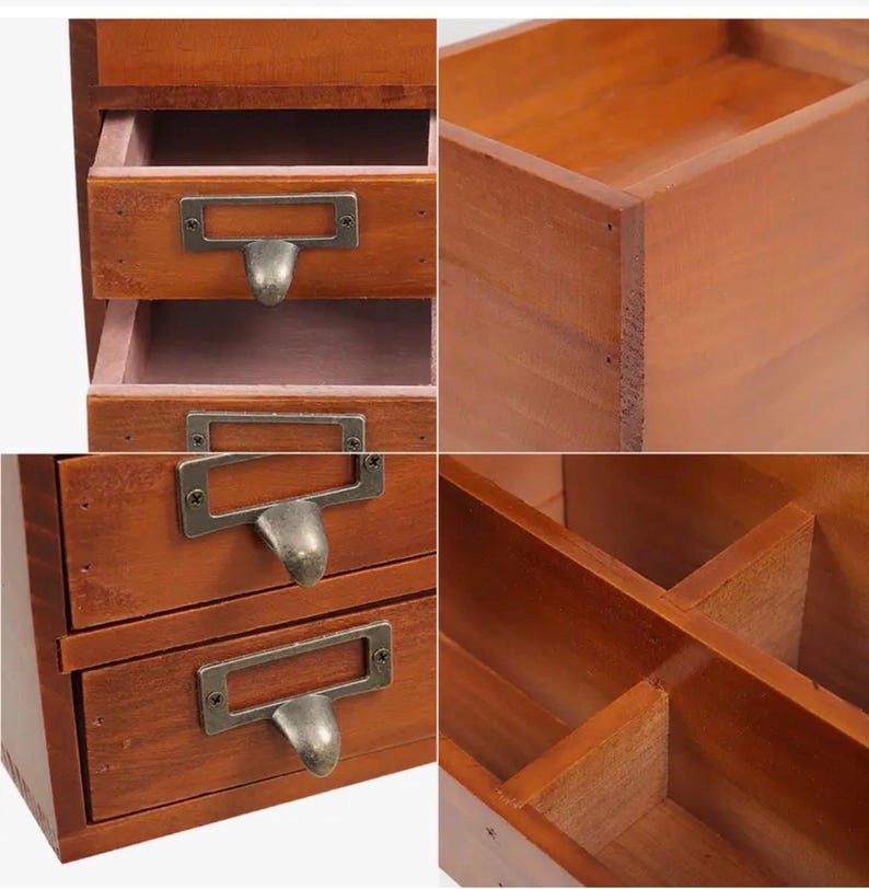 Close-up of wooden desk organiser drawers with metal handles
