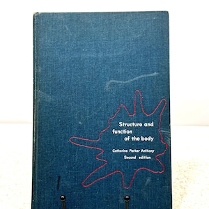 May include: A vintage book titled "Structure and function of the body" by Catherine Parker Anthony. The book has a dark blue cover with red accents and text. The second edition is displayed.