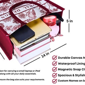 May include: A red and white floral tote bag with a 12-inch by 14-inch by 5-inch dimension. The bag is made of durable canvas material and has a waterproof lining. It features a magnetic snap closure and is spacious and stylish. The bag has custom names on both sides.