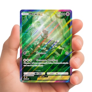 May include: A holographic Pokémon trading card featuring Mew ex. The card has a green and blue background with a light purple Mew character. The card text includes "Psyshot" and "Genome Hacking".