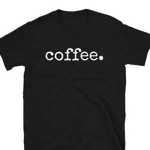 May include: Black short-sleeved t-shirt with the word "coffee" printed in white on the front.
