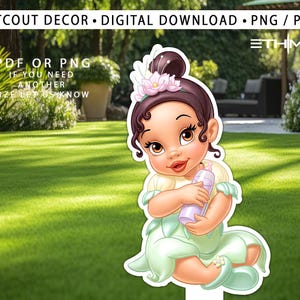 May include: Cutout decor of a baby princess in a light green dress, holding a purple bottle. The princess has brown hair with a pink flower and is smiling. The image includes the text "CUTOUT DECOR • DIGITAL DOWNLOAD • PNG / PDF".