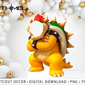 May include: A cutout of Bowser, a video game character, with a green shell and red spikes. Bowser is yellow and has a white circle for a face. The background is white with gold and white balloons.