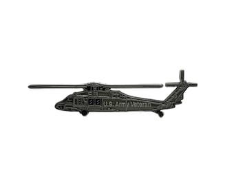 May include: A detailed, metallic gray helicopter pin. The pin features a detailed design of a helicopter with the text "U.S. Army Veteran" inscribed on the side. The pin has a horizontal orientation and is set against a white background.
