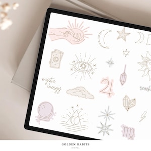 May include: A digital tablet screen displaying a collection of line art stickers featuring celestial and mystical motifs including hands holding a sun, crescent moons, stars, a tarot card, an eye, a crystal ball, clouds, crystals, and the text mystic energy.