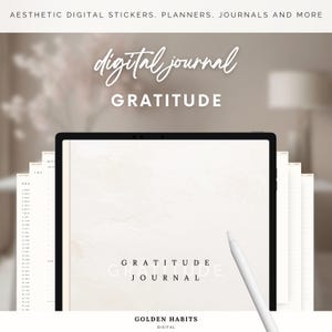 May include: A digital journal with a white background and the text "digital journal GRATITUDE" in black. The journal is open on a tablet screen and a stylus is resting on the screen. The text "GRATITUDE JOURNAL" is also visible on the screen.