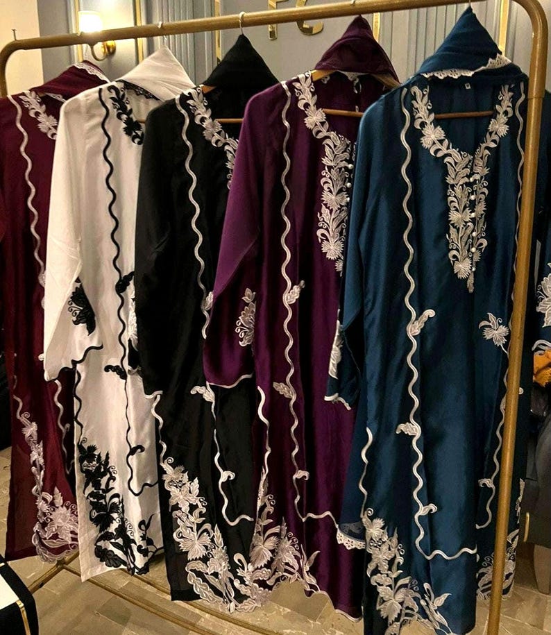 Elegant raw silk embroidered suit designed for Pakistani formal and party wear. Perfect festive and wedding outfit with fine embroidery and premium fabric, making it an ideal Pakistani formal suit or stylish party wear for women seeking timeless traditional elegance
