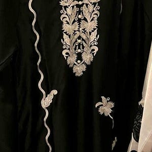 Elegant raw silk embroidered suit designed for Pakistani formal and party wear. Perfect festive and wedding outfit with fine embroidery and premium fabric, making it an ideal Pakistani formal suit or stylish party wear for women seeking timeless traditional elegance