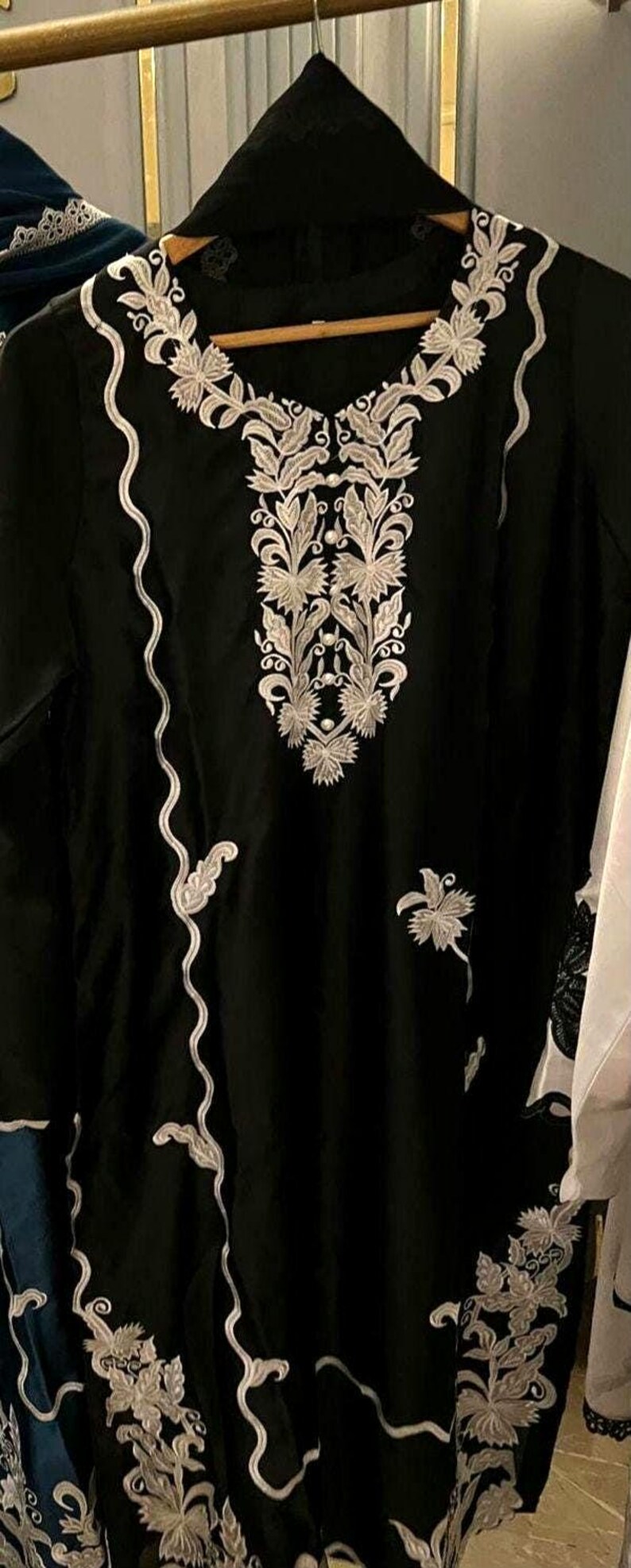 Elegant raw silk embroidered suit designed for Pakistani formal and party wear. Perfect festive and wedding outfit with fine embroidery and premium fabric, making it an ideal Pakistani formal suit or stylish party wear for women seeking timeless traditional elegance