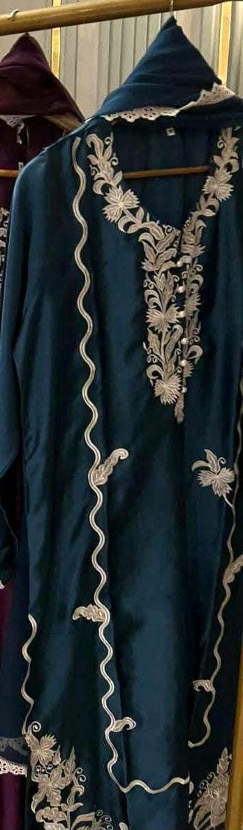 Elegant raw silk embroidered suit designed for Pakistani formal and party wear. Perfect festive and wedding outfit with fine embroidery and premium fabric, making it an ideal Pakistani formal suit or stylish party wear for women seeking timeless traditional elegance