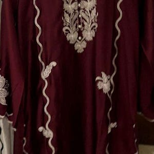 Elegant raw silk embroidered suit designed for Pakistani formal and party wear. Perfect festive and wedding outfit with fine embroidery and premium fabric, making it an ideal Pakistani formal suit or stylish party wear for women seeking timeless traditional elegance