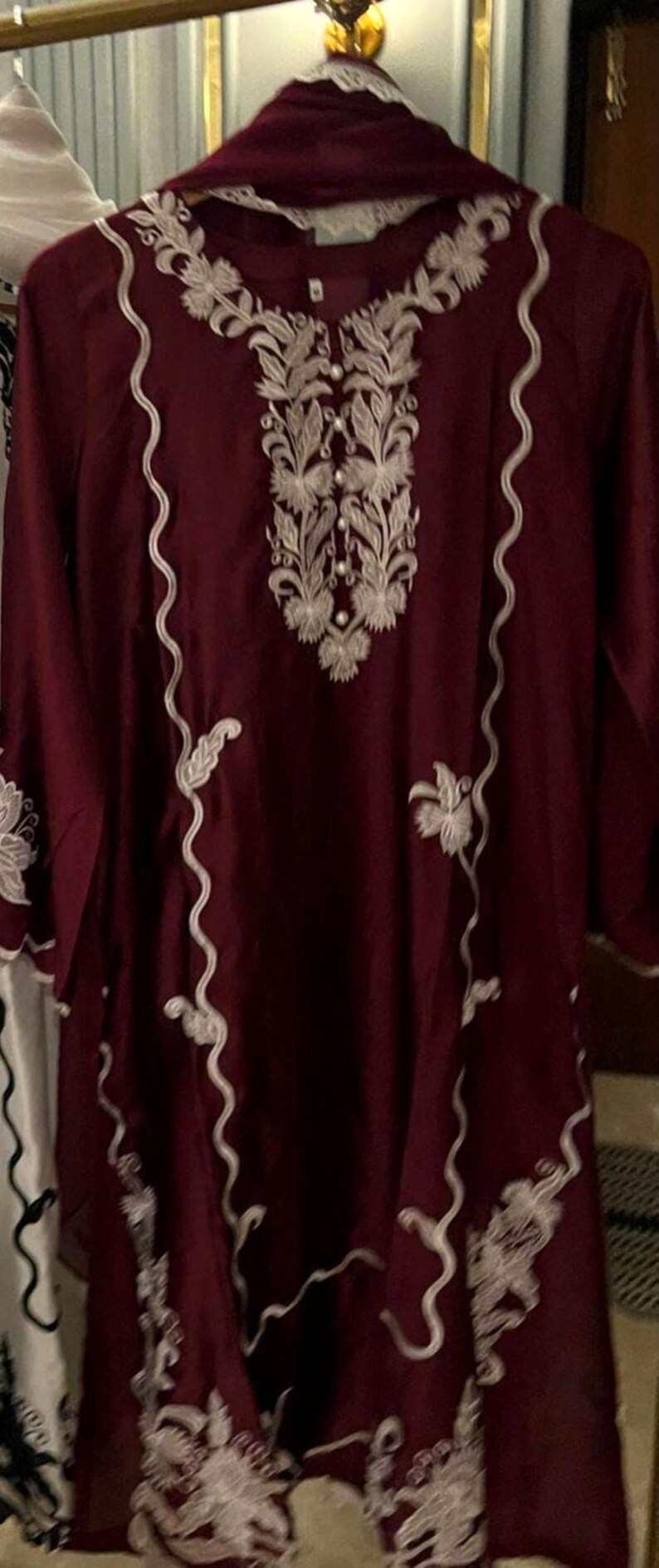 Elegant raw silk embroidered suit designed for Pakistani formal and party wear. Perfect festive and wedding outfit with fine embroidery and premium fabric, making it an ideal Pakistani formal suit or stylish party wear for women seeking timeless traditional elegance