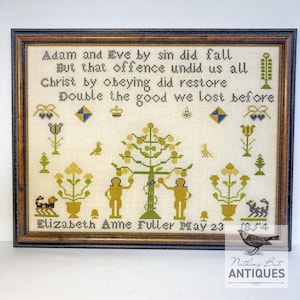 May include: Framed antique needlepoint sampler with a brown wooden frame. The sampler features a biblical scene with figures, trees, and text. The text reads "Adam and Eve by sin did fall." The sampler is dated May 23, 1854.