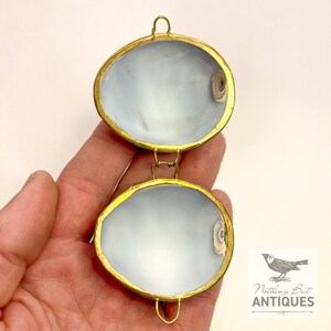 Vintage Sea Shell Coin Purses/Pill Boxes, Victorian Style With Brass Frames, Set of 3, ca. 1960s - 70s. Crafted from three different sea shells in three DIFFERENT SIZES, these LOVELY COIN PURSES or PILL BOXES would make lovely DECORATOR ITEMS in any bedroom or bathroom, especially for a BEACHFRONT PROPERTY. The large shell is 3-1/4 in. from front to back; the medium shell 2-1/4 in., and the small shell is 1-3/4 in. front to back. Price: $75 with FREE SHIPPING.