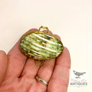 Vintage Sea Shell Coin Purses/Pill Boxes, Victorian Style With Brass Frames, Set of 3, ca. 1960s - 70s. Crafted from three different sea shells in three DIFFERENT SIZES, these LOVELY COIN PURSES or PILL BOXES would make lovely DECORATOR ITEMS in any bedroom or bathroom, especially for a BEACHFRONT PROPERTY. The large shell is 3-1/4 in. from front to back; the medium shell 2-1/4 in., and the small shell is 1-3/4 in. front to back. Price: $75 with FREE SHIPPING.