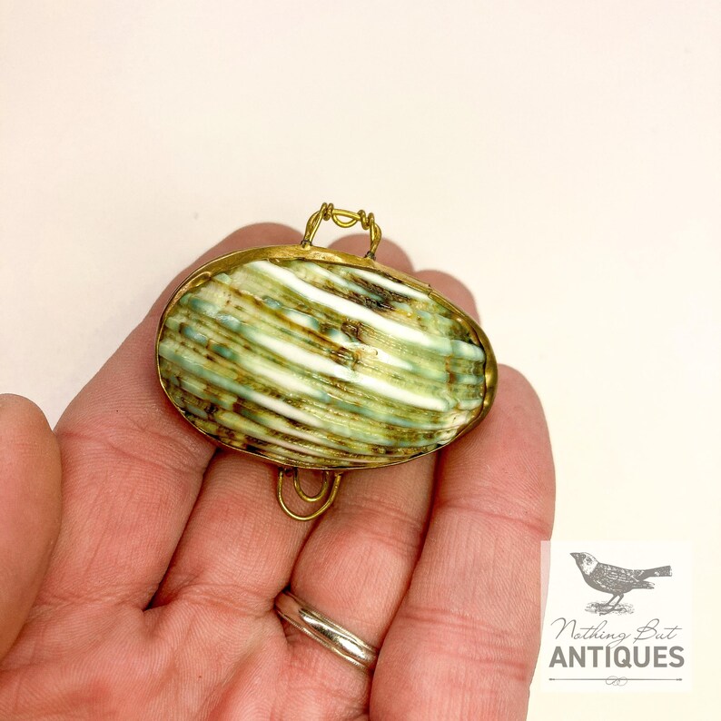 Vintage Sea Shell Coin Purses/Pill Boxes, Victorian Style With Brass Frames, Set of 3, ca. 1960s - 70s. Crafted from three different sea shells in three DIFFERENT SIZES, these LOVELY COIN PURSES or PILL BOXES would make lovely DECORATOR ITEMS in any bedroom or bathroom, especially for a BEACHFRONT PROPERTY. The large shell is 3-1/4 in. from front to back; the medium shell 2-1/4 in., and the small shell is 1-3/4 in. front to back. Price: $75 with FREE SHIPPING.