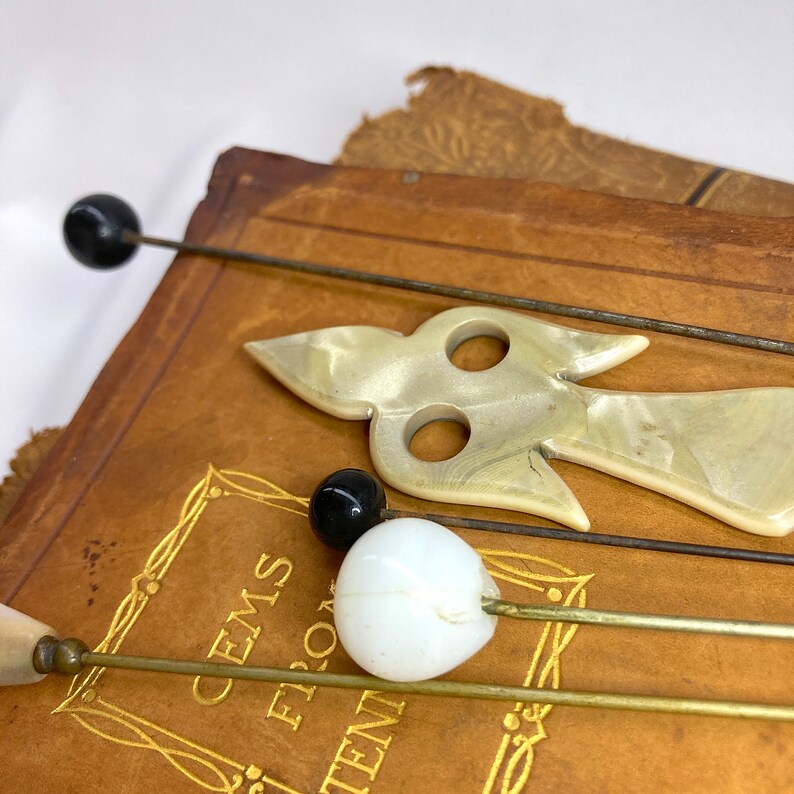 Wonderful Hat Pins Victorian Antique Set of 5 Hand Carved Mother of Pearl MOP and Glass, ca. 1900s. The longest hat pin is 10.75 in. long. They are simply lovely! Price: $72 with FREE SHIPPING at https://NothingButAntiques.etsy.com.