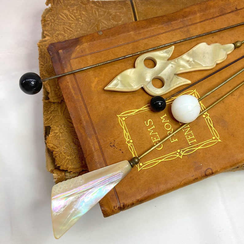 Wonderful Hat Pins Victorian Antique Set of 5 Hand Carved Mother of Pearl MOP and Glass, ca. 1900s. The longest hat pin is 10.75 in. long. They are simply lovely! Price: $72 with FREE SHIPPING at https://NothingButAntiques.etsy.com.