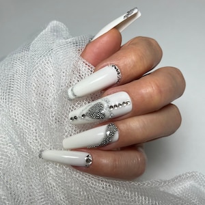 Wedding nails . White press on nail gel tips with rhinestones and silver decorations