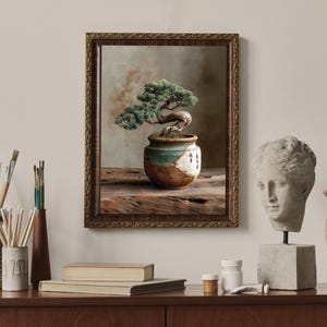 May include: A framed picture of a bonsai tree in a decorative pot. The pot is placed on a wooden surface. The image is surrounded by art supplies, a bust, and a wooden hand.