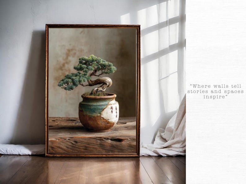 May include: A framed print of a bonsai tree in a ceramic pot. The tree has green leaves and a curved trunk. The pot is brown, white, and teal. The print is on a wooden table with the text "Where walls tell stories and spaces inspire".