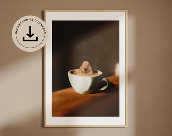 May include: A white coffee cup with a brown liquid and a capybara sitting in it. The cup is on a wooden table with a brown background.