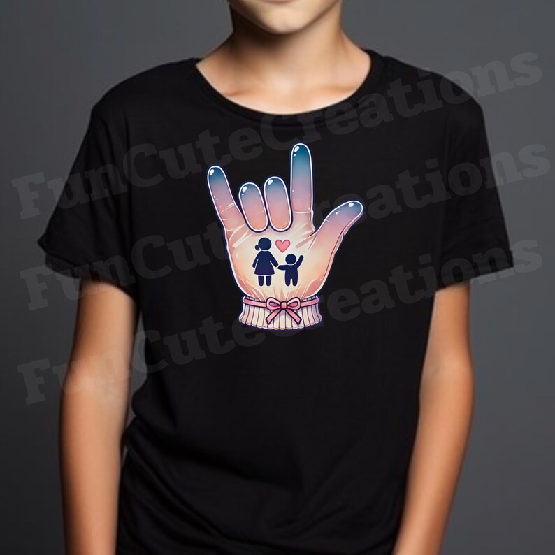 May include: A black t-shirt with a colorful illustration of a hand signing "I love you" in American Sign Language. The hand is holding a small heart and two stick figures representing a family.