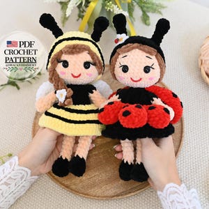 May include: Two handmade crochet dolls, one dressed as a bee and the other as a ladybug. The bee doll has a yellow and black striped dress, while the ladybug doll has a black dress with red polka dots. Both dolls have smiling faces and black antennae. The image includes text that says "PDF Crochet Pattern".