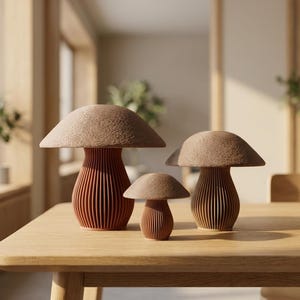 May include: Three mushroom-shaped decorative objects of varying sizes. Each piece features a textured, rounded brown cap and a base with vertical, ribbed, terracotta-colored slats. The objects are arranged in a cluster, showcasing their distinct heights.