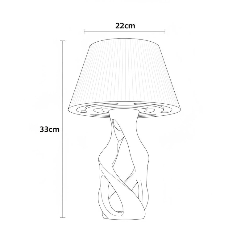 May include: A white table lamp with a pleated lampshade, 22 cm wide and 33 cm tall. The lamp base has an abstract, intertwined design. The lamp is a line drawing.