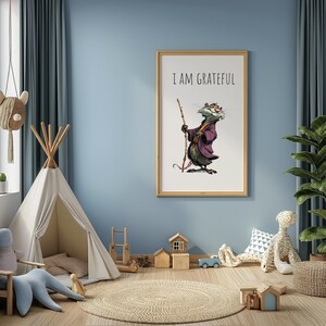 May include: A framed print with the text "I AM GRATEFUL" above an illustration of a possum in a purple robe holding a staff. The artwork is displayed in a child's room with a teepee, rug, and wooden toys.