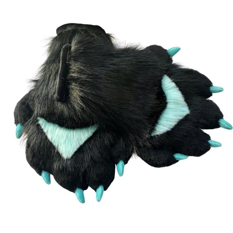 May include: A pair of black faux fur bear paws with light blue accents and claws. The paws have a realistic design with long, soft fur and are designed to be worn as part of a costume or cosplay.
