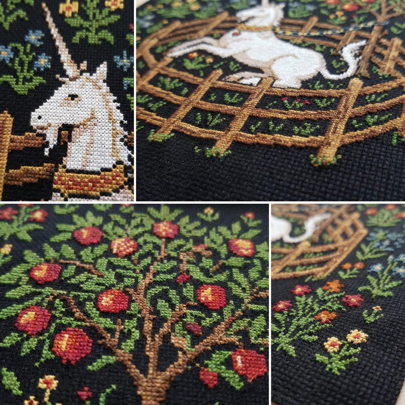 May include: Cross-stitch embroidery on black fabric featuring a white unicorn within a wooden fence, surrounded by flowers and foliage. The design includes a tree with red apples. The needlework showcases detailed stitching and a medieval theme.
