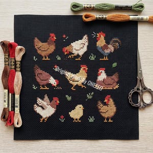 May include: Cross-stitch embroidery on black fabric featuring various chickens and a chick in shades of brown, white, and yellow. The text "Original Work By ONESEO" is visible. Embroidery floss and scissors are also in the image.
