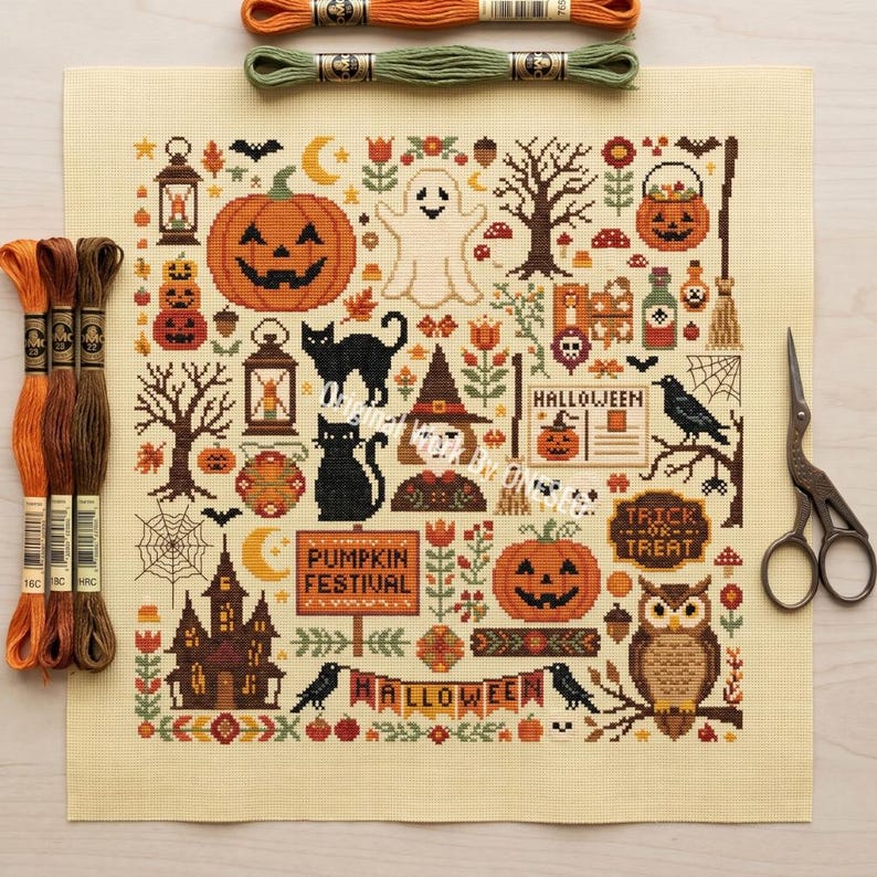 May include: A square piece of cream-colored Aida fabric featuring a cross-stitch pattern with Halloween motifs including pumpkins, a ghost, black cats, an owl, a haunted house, and text reading Pumpkin Festival, Halloween, and Trick or Treat.
