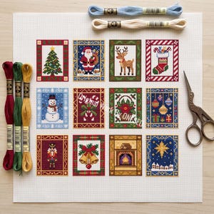 May include: A white cross-stitch fabric featuring twelve rectangular Christmas-themed designs, including a tree, Santa, reindeer, stocking, snowman, candy canes, poinsettia, ornaments, nutcracker, bells, fireplace, and star. Includes embroidery floss and scissors.