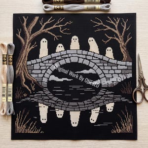May include: A cross-stitch pattern on black fabric featuring a stone bridge with a reflection in water, surrounded by bare trees and ghost figures. The text Original Work By ONESEO is centered. Includes three skeins of embroidery floss and scissors.