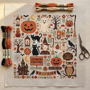 May include: A cross-stitch sampler on light fabric featuring Halloween motifs including pumpkins, a ghost, black cats, an owl, a witch, a haunted house, and text reading Pumpkin Festival, Halloween, and Trick or Treat, with embroidery floss and scissors.