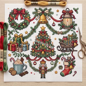 May include: A cross-stitch pattern on white fabric featuring a central Christmas tree surrounded by a wreath, a bell, a lantern, gifts, a sleigh, a mug with a drink, a nutcracker, and a stocking, accompanied by embroidery floss and scissors.