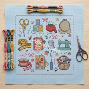 May include: A light blue cross-stitch fabric featuring various sewing motifs including scissors, spools of thread, a tomato pincushion, a sewing machine, a measuring tape, and buttons. Three embroidery floss skeins and metal scissors are placed nearby.