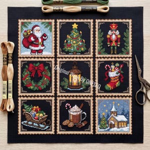 May include: A black fabric square featuring nine embroidered Christmas-themed squares, including Santa, a tree, a nutcracker, a wreath, a lantern, a stocking, a sleigh, hot cocoa, and a church. Two tan embroidery floss skeins and scissors are present.