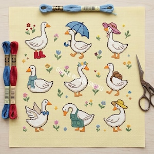 May include: Cross-stitch pattern featuring nine geese, each adorned with accessories like boots, hats, and scarves. The geese are surrounded by flowers on a yellow background. Embroidery floss and scissors are also visible.