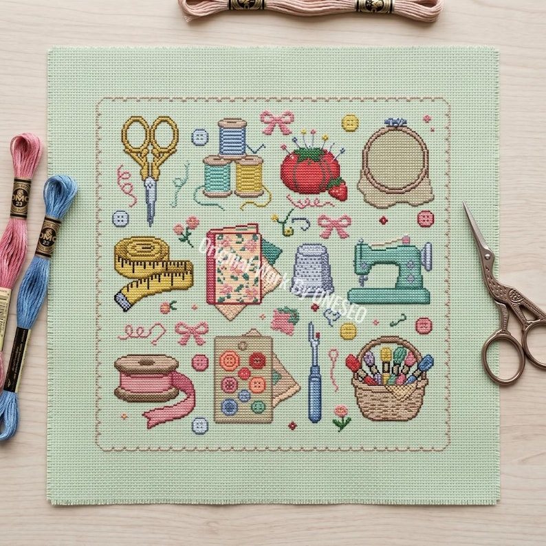 May include: A light green cross-stitch fabric featuring a grid of sewing motifs including gold scissors, colorful thread spools, a red tomato pincushion, a measuring tape, a sewing machine, a thimble, buttons, and a basket of embroidery floss.