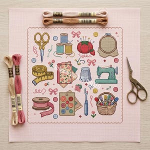 May include: A cross-stitch pattern on light pink fabric featuring sewing motifs including scissors, thread spools, a pincushion, a measuring tape, a thimble, a sewing machine, a button card, and a basket. Two pairs of scissors and four embroidery floss skeins are placed around the fabric.