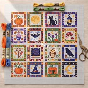 May include: A cross-stitch pattern on white fabric featuring sixteen square motifs with Halloween themes including pumpkins, a black cat, a lantern, a bat, mushrooms, an owl, a raven, and an ancient spell book, with embroidery floss and scissors.