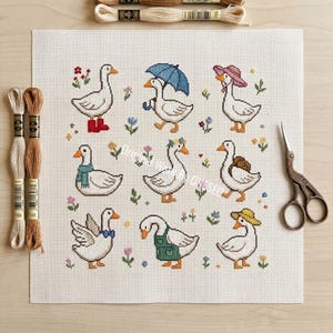 May include: A cross-stitch pattern featuring nine whimsical geese, each adorned with unique accessories like hats, scarves, and boots. The geese are surrounded by colorful flowers and greenery, creating a charming and detailed design.