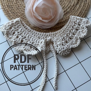 May include: A crocheted collar with a scalloped edge and a tie fastening. The collar is beige and has a delicate, feminine look. The image also includes the text "PDF PATTERN".