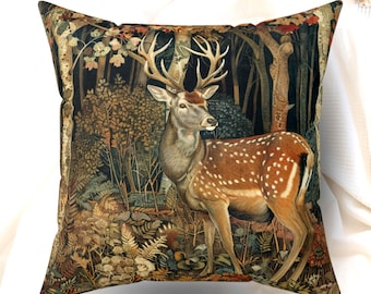 May include: A square throw cushion featuring a detailed illustration of a spotted deer with large antlers standing in a dense forest. The scene includes dark trees, ferns, and foliage in shades of brown, green, and orange, creating a rich woodland motif.