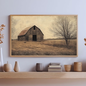 May include: A rectangular wall art print featuring a weathered wooden barn with a rusted metal roof situated in a dry, grassy field next to a large, leafless tree under a muted, overcast sky, all enclosed within a simple light wood frame.