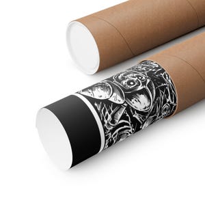 May include: Two brown cardboard poster tubes with white end caps. One tube is unrolled, revealing a black and white illustration of a creature. The other tube is rolled up. The illustration is detailed and artistic.